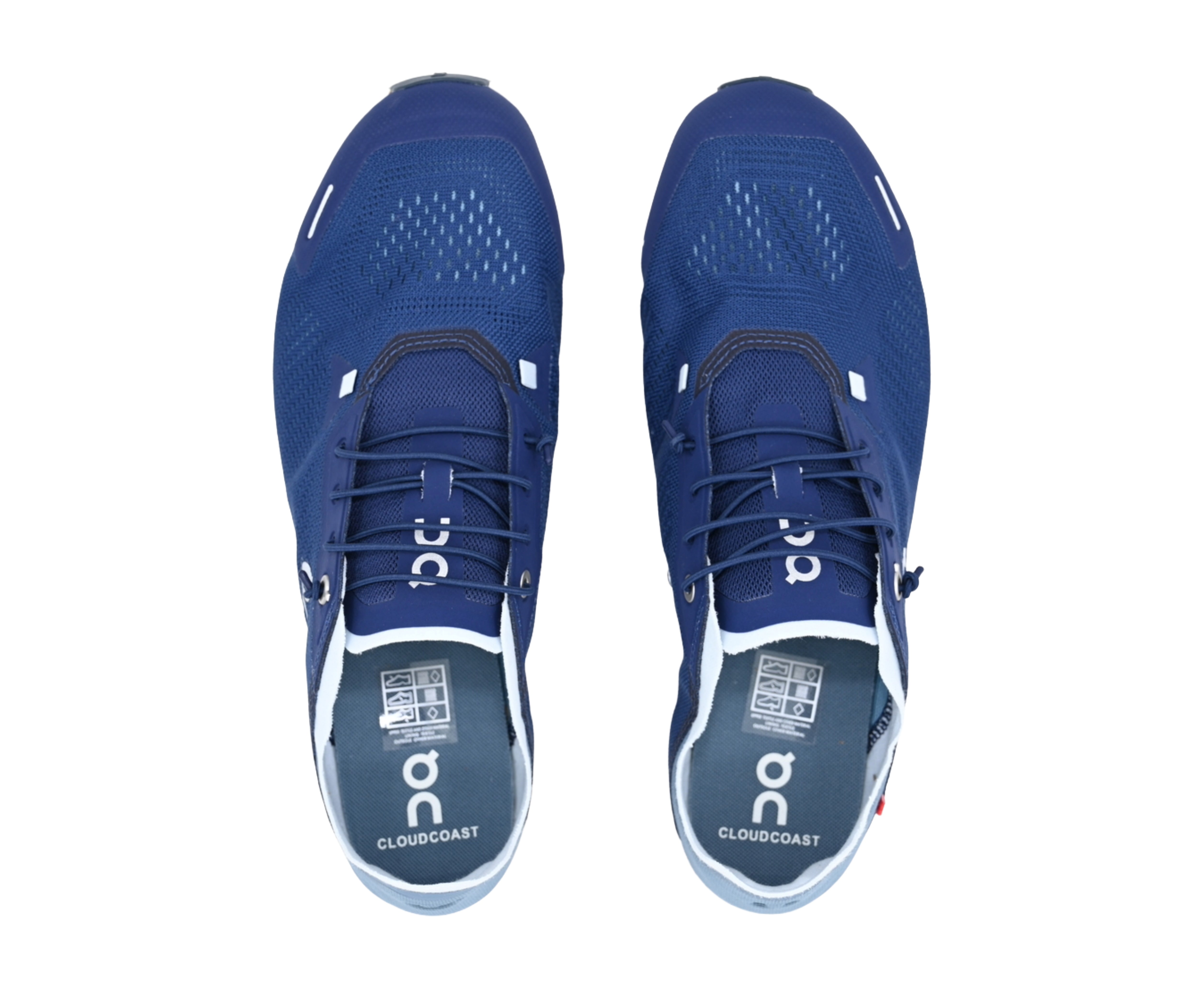 Pair of blue athletic shoes with white soles on a white background