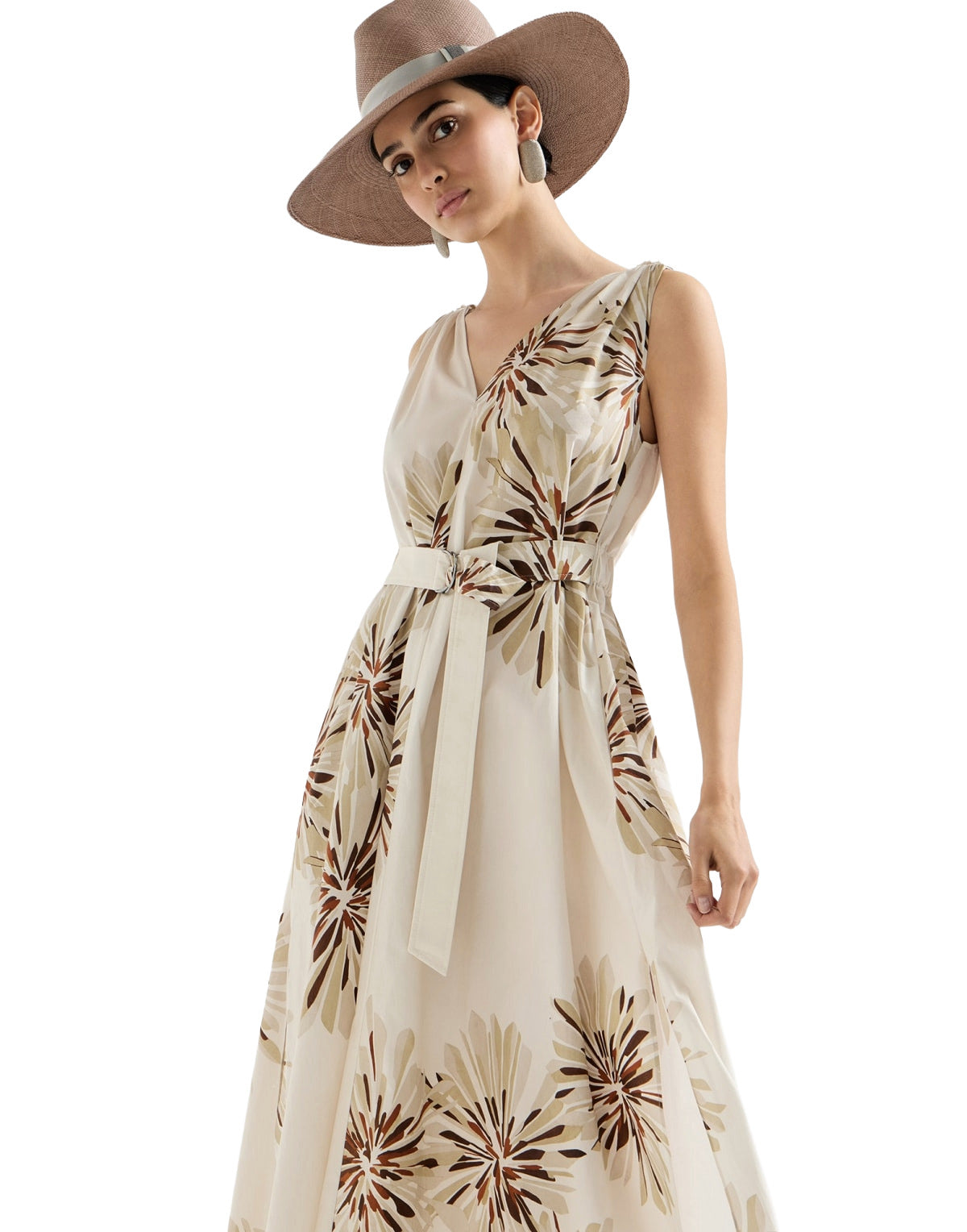 Woman wearing a floral dress and hat on a white background