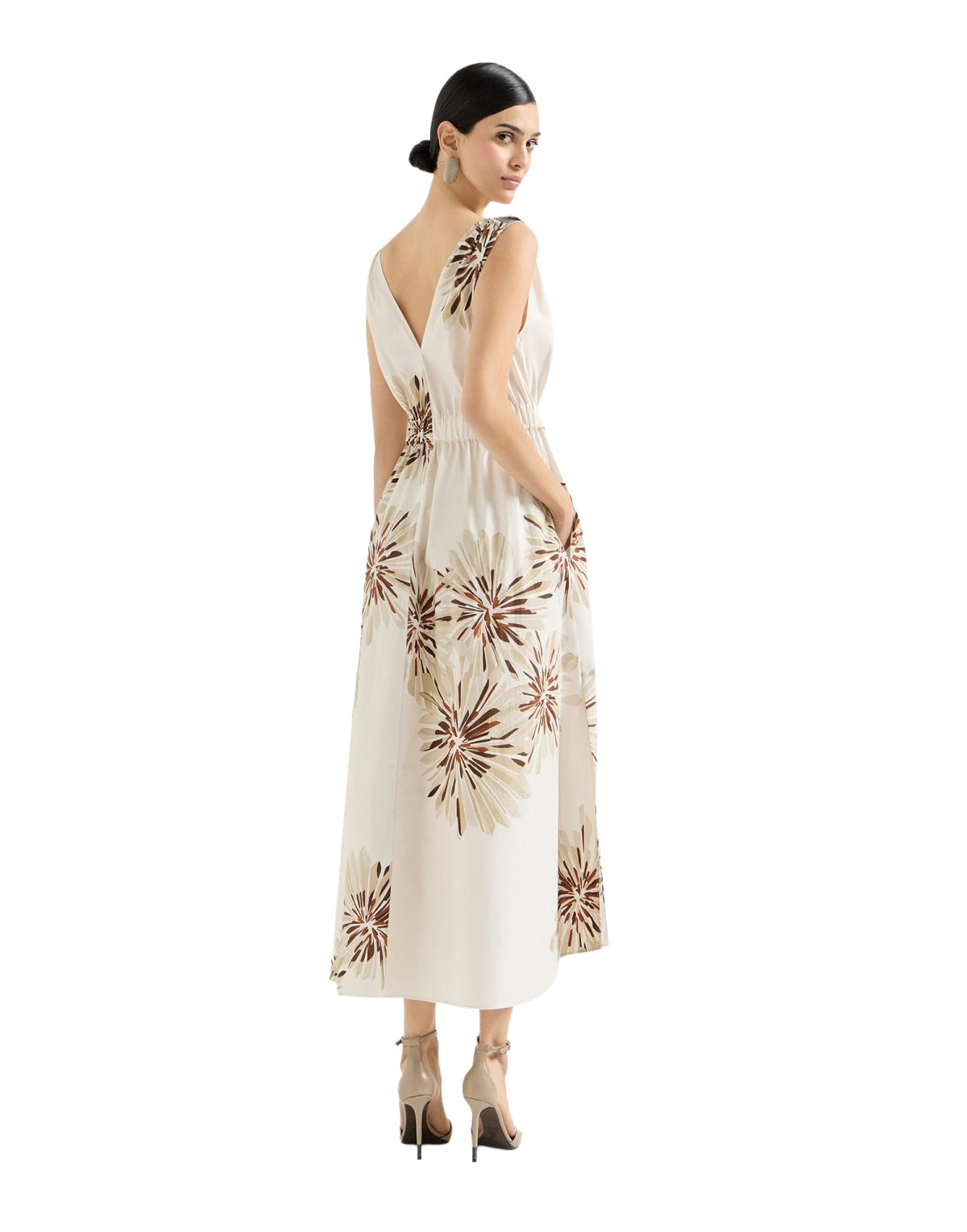 Woman wearing a floral dress on a white background