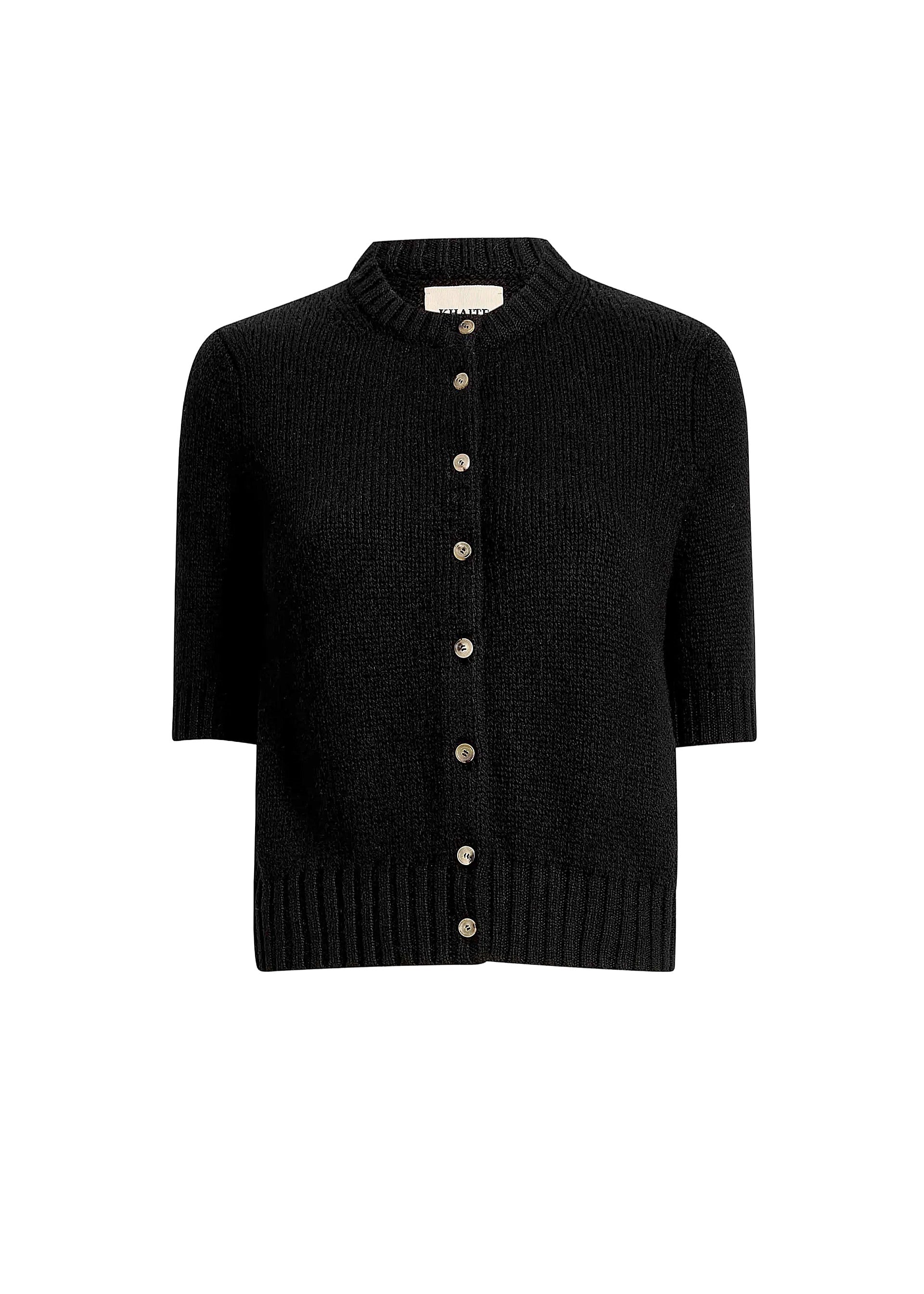 Black cardigan with button details on a white background
