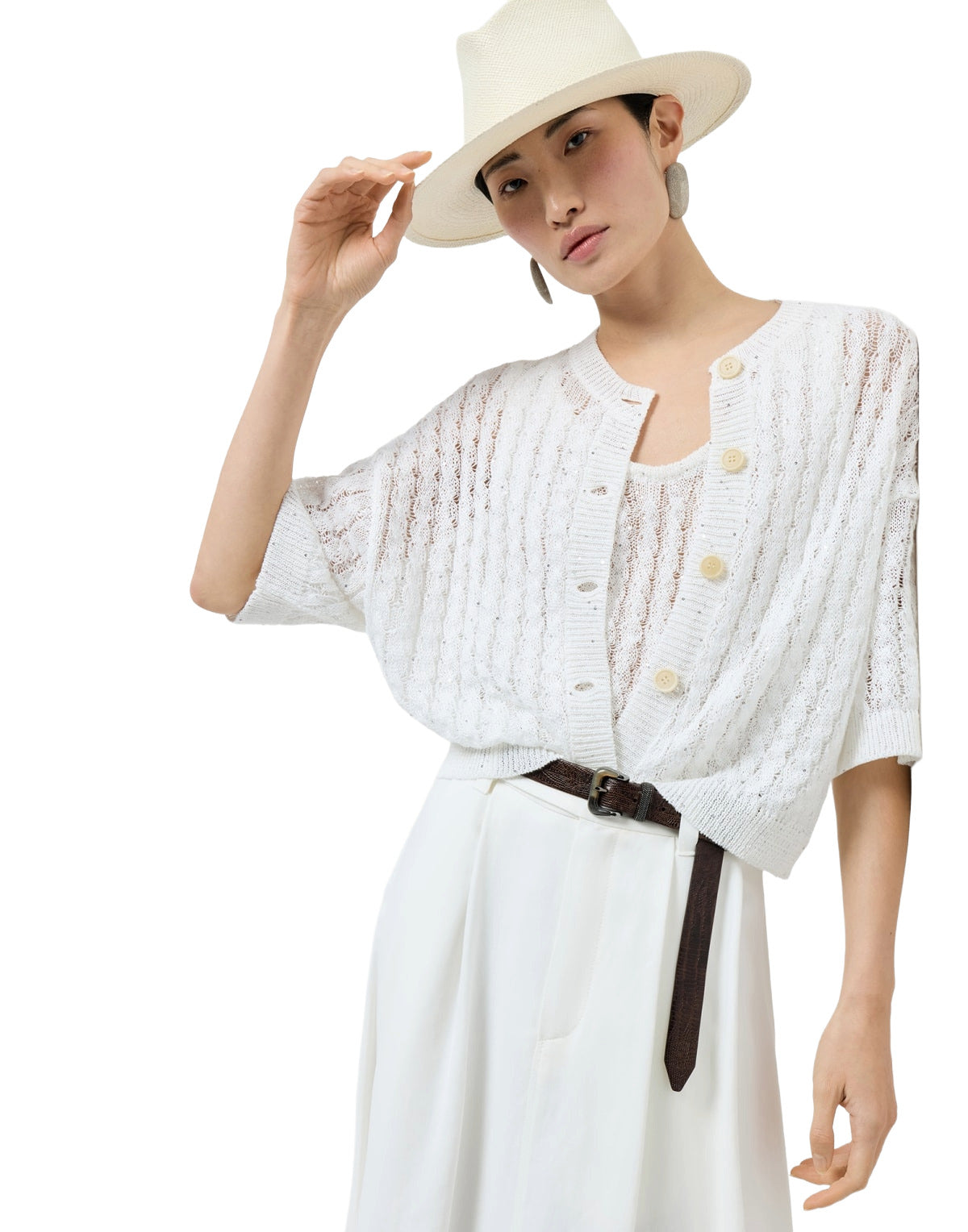 Woman wearing a white outfit with a hat on a white background