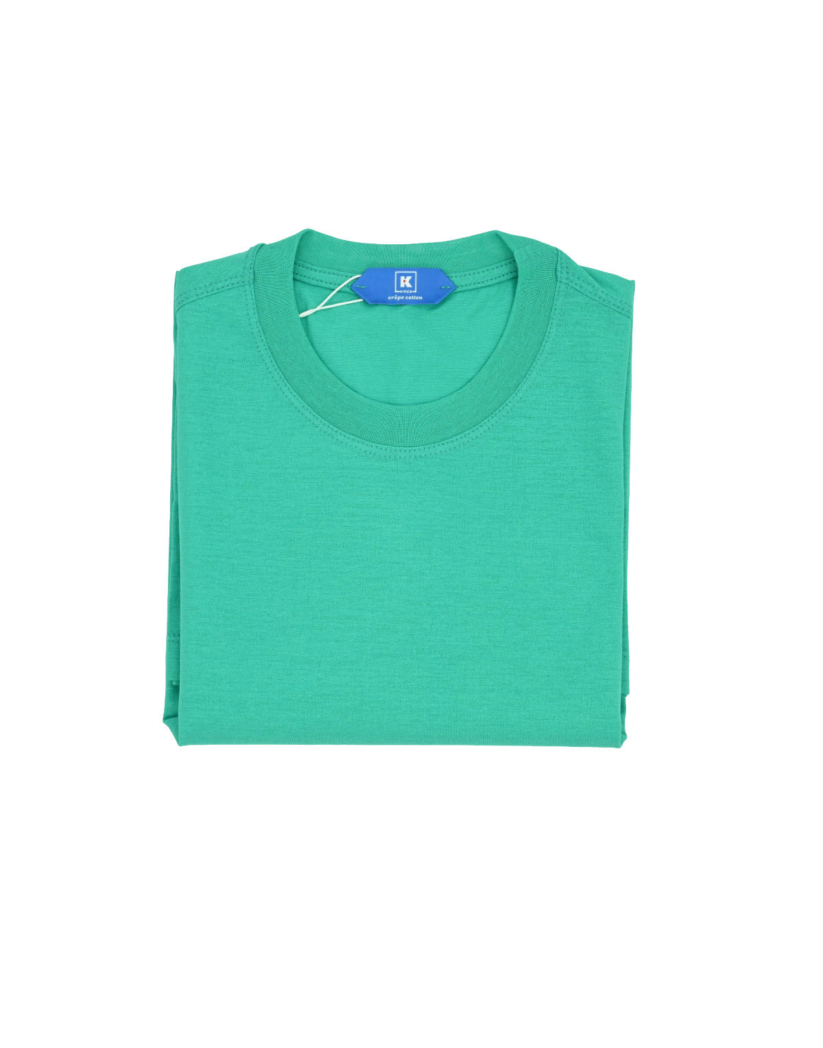 Folded green t-shirt with a brand tag on a white background