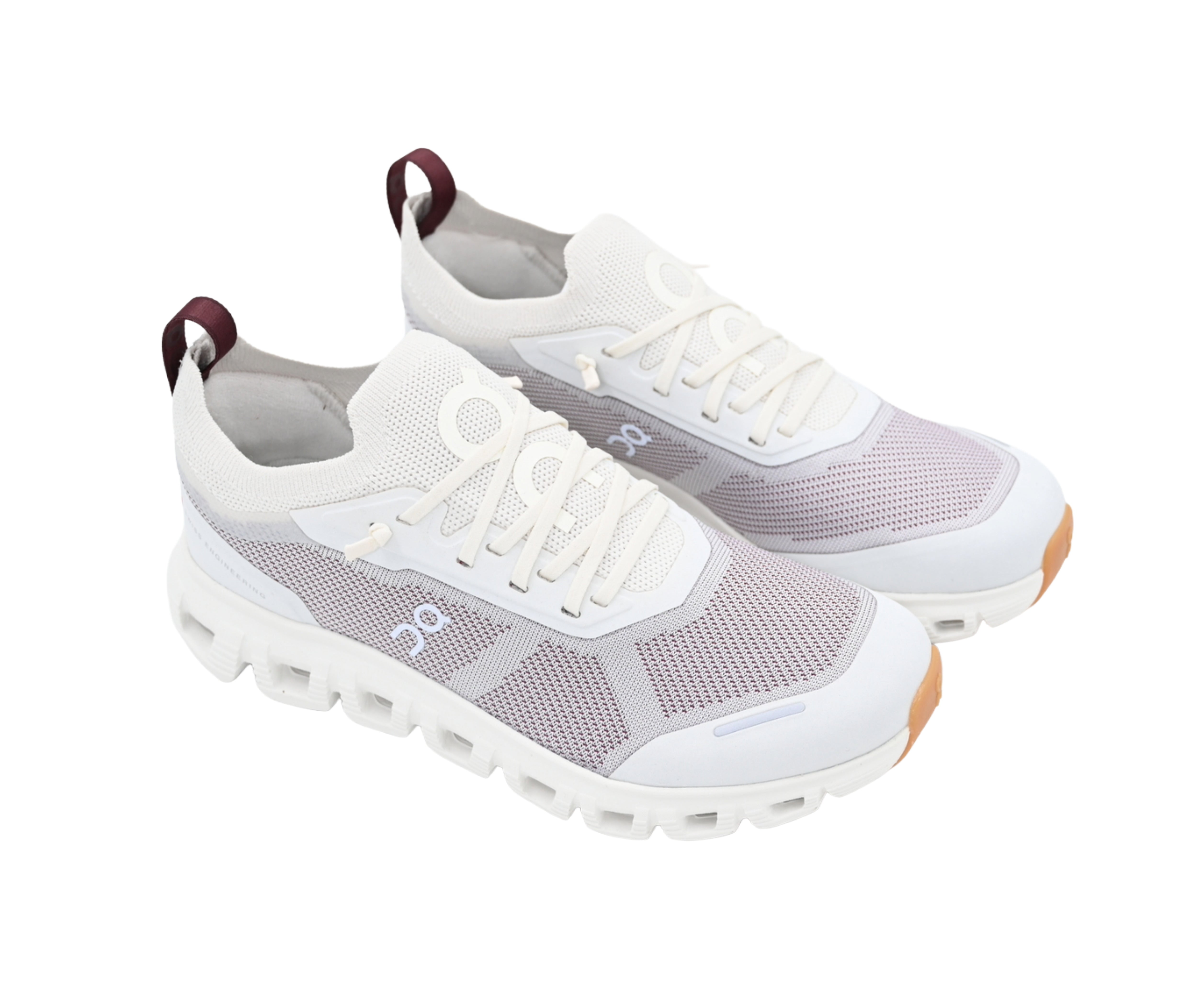 White and gray sneakers with brown soles on a white background