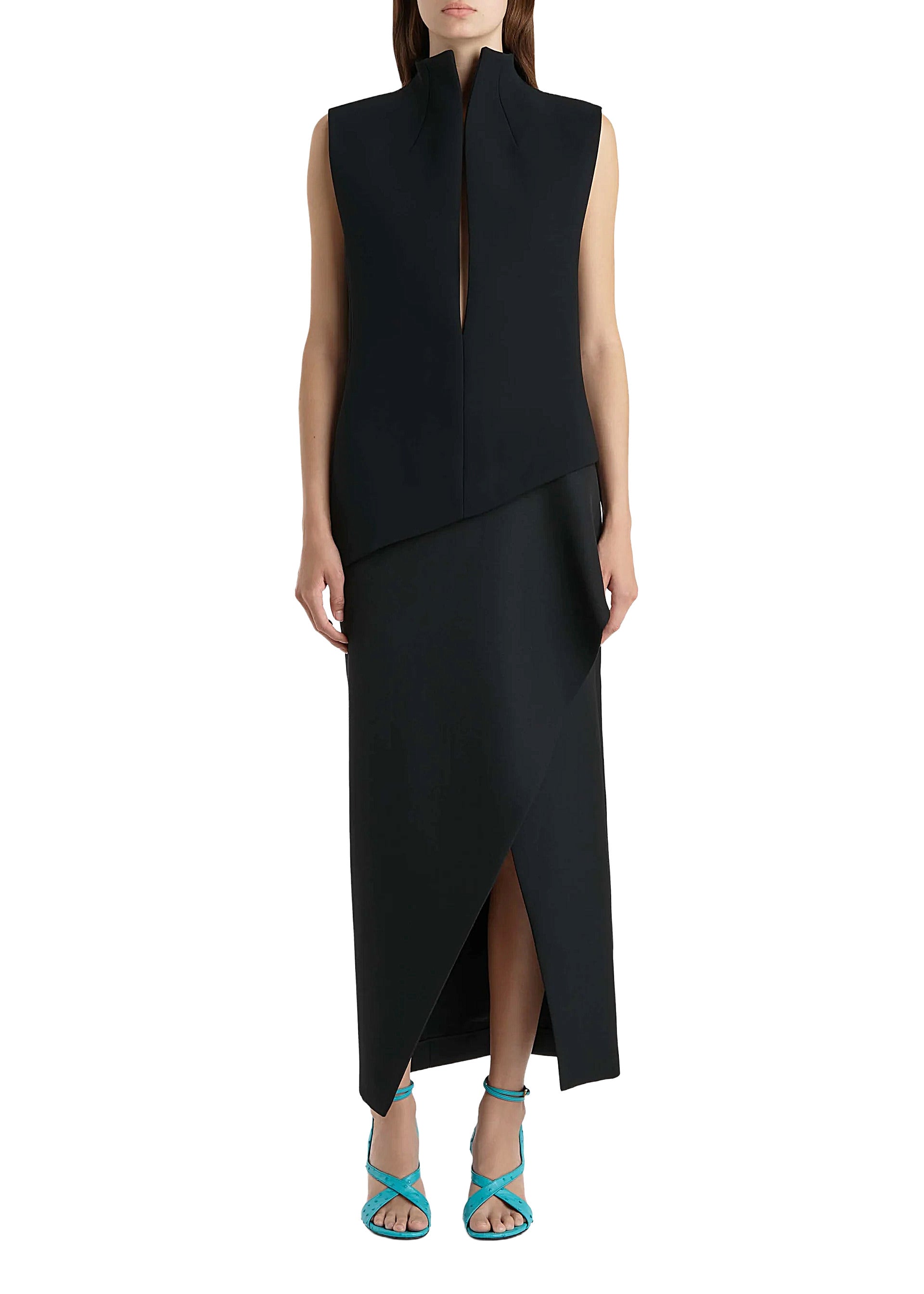 Black sleeveless dress with a slit on a white background