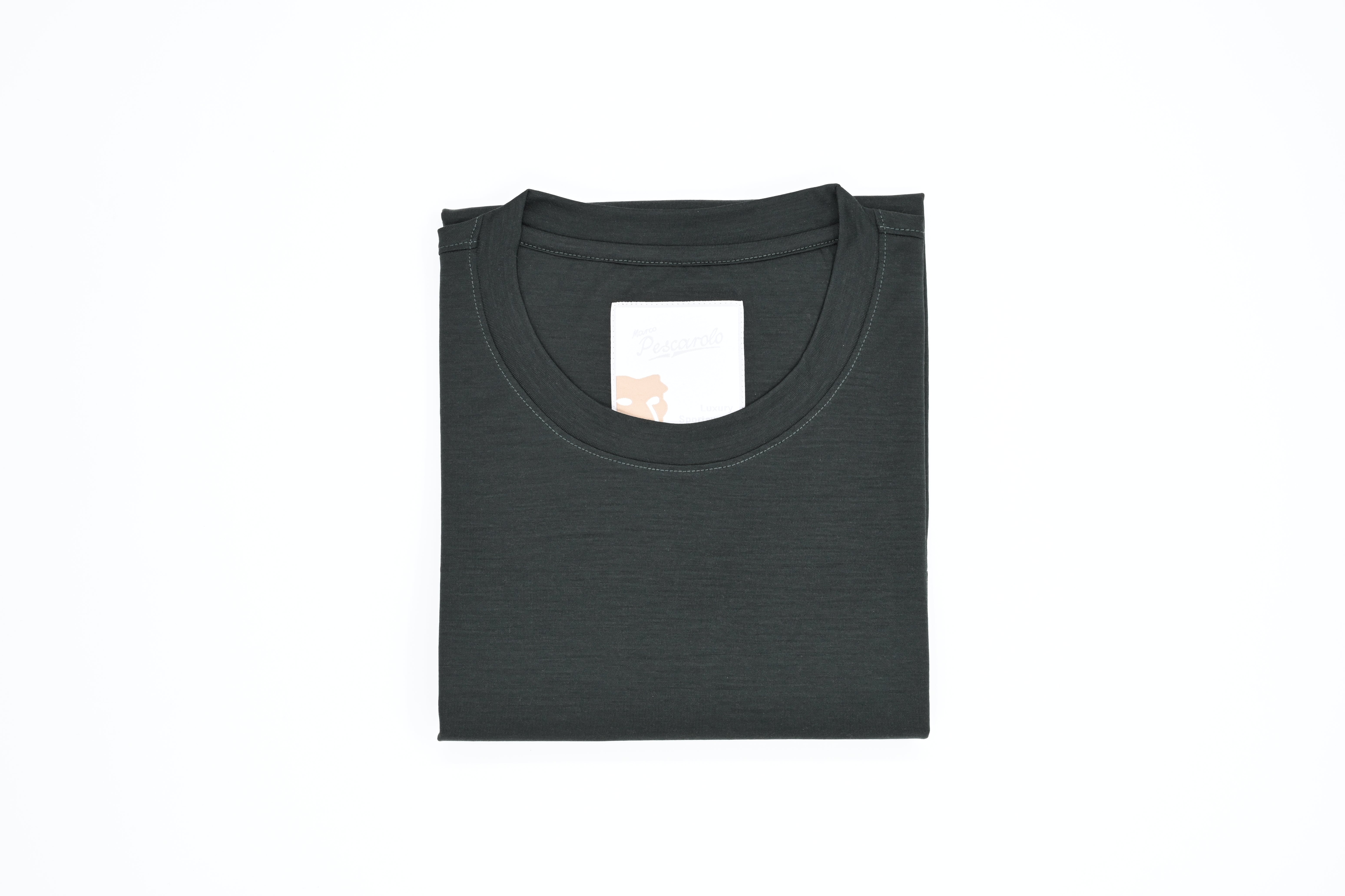 Folded black t-shirt on a white background