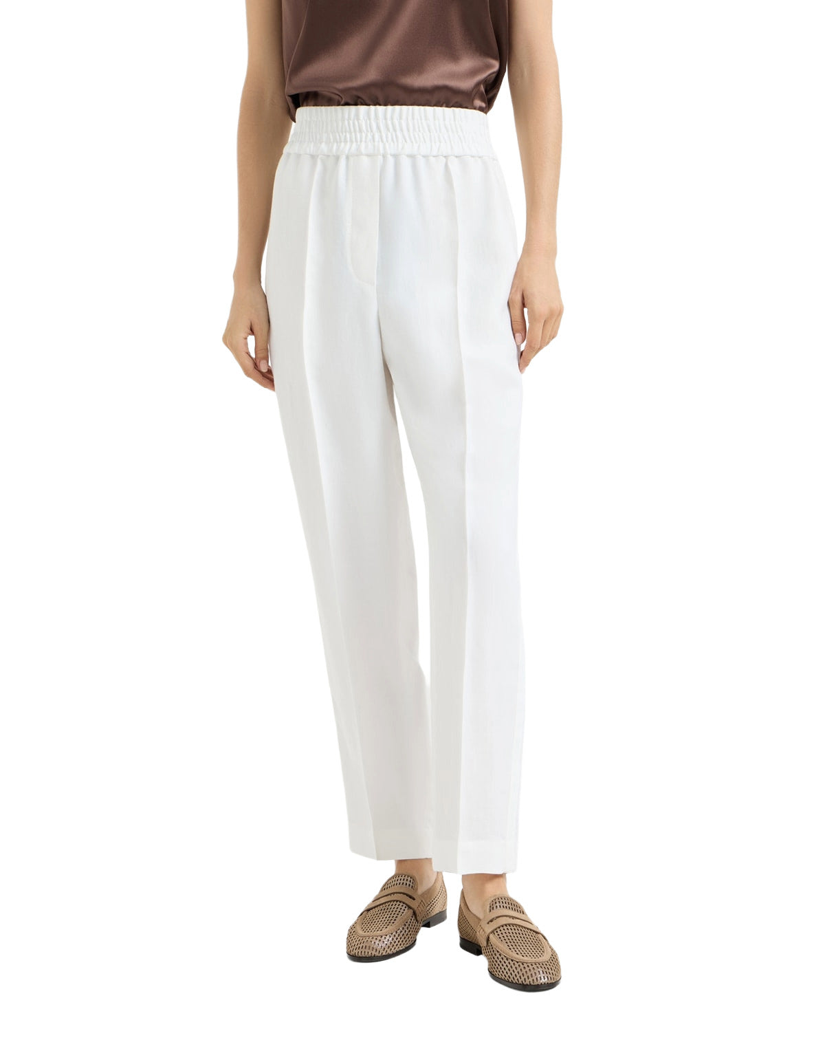 Person wearing white pants on a white background